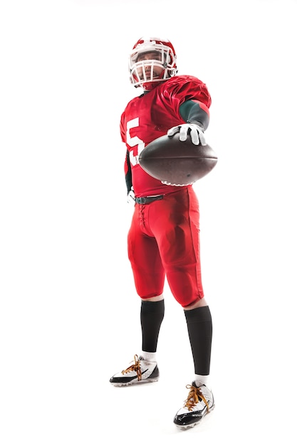 Caucasian fitness man as american football player holding a ball on white background