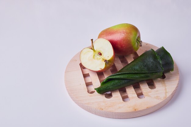 Caucasian fruit lavash with apple on a wooden platter.