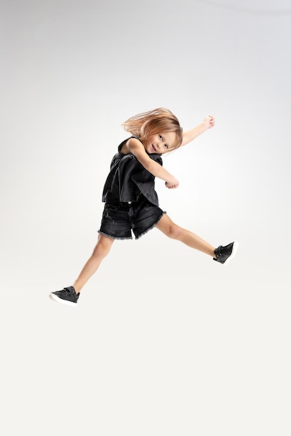 Caucasian girl isolated on white studio background Copyspace Childhood education emotions concept