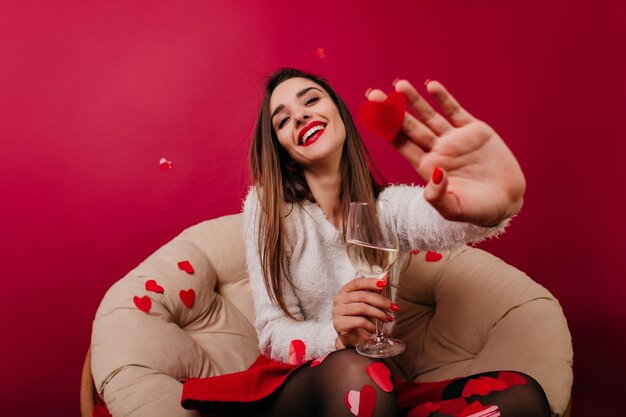 Caucasian girl in white sweater having fun during romantic date