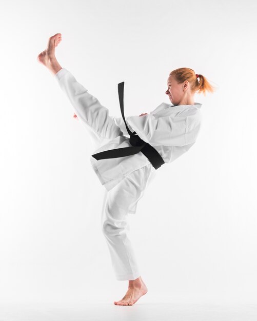 Caucasian karate fighter practicing full shot