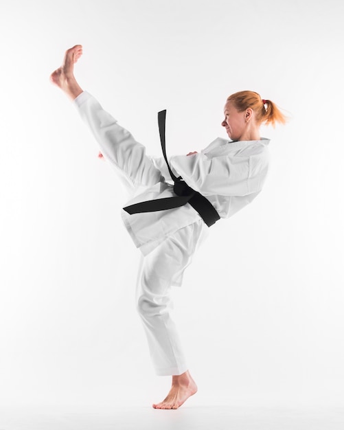 Caucasian karate fighter practicing full shot