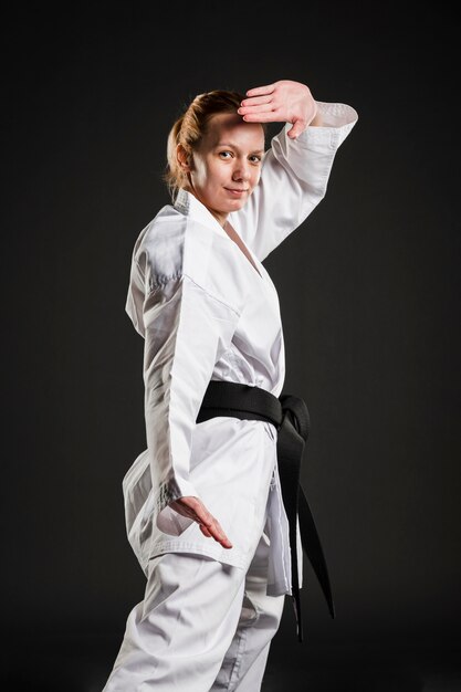Caucasian karate woman posing medium shot