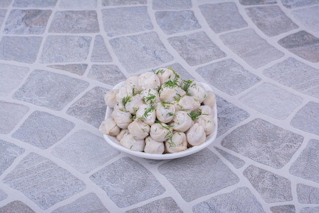 Caucasian khinkal dough stuffings in a white plate.