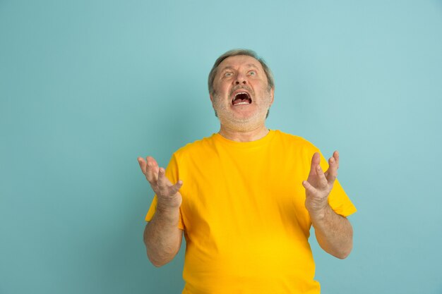 Caucasian man Angry screaming up isolated on blue