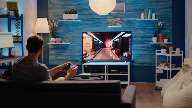 Free Photo caucasian man playing action games on tv console