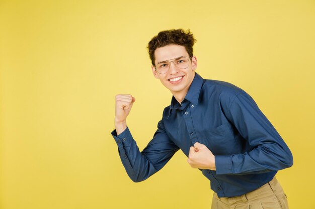 Caucasian man's portrait isolated on yellow studio background with copyspace