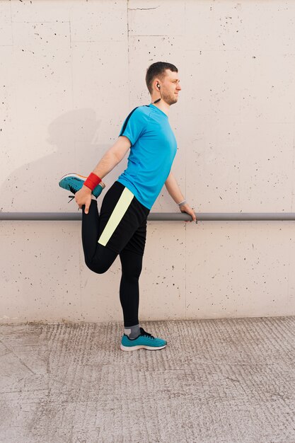 Caucasian man stretching city workout