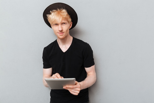 Caucasian man using tablet computer.