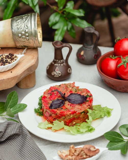 Caucasian mangal salad with red basilic leaves and green lettuce.