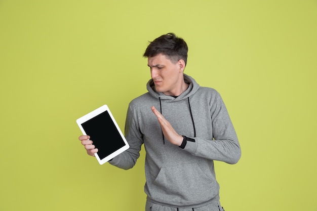 Caucasian mans portrait isolated on yellow studio wall