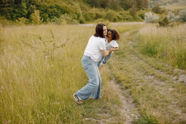 Caucasian mother and her african american daughter together