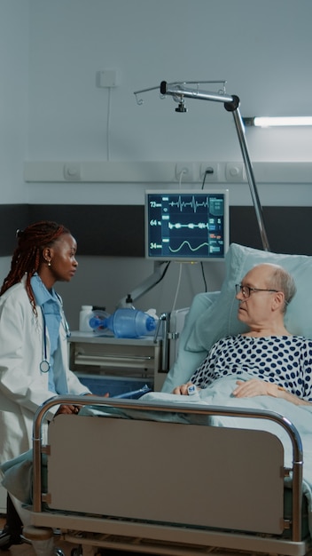 Free photo caucasian nurse checking information files on patient