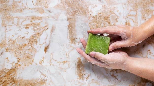 Caucasian person washing hands