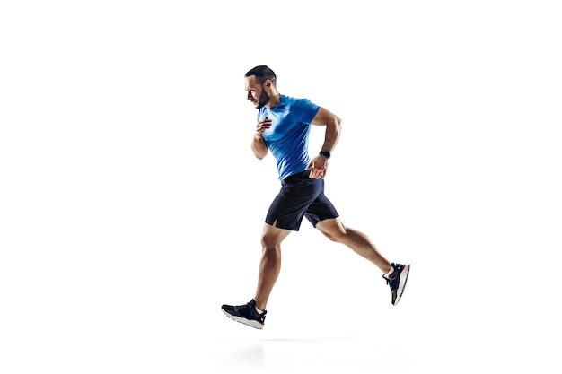 Caucasian professional male athlete, runner training isolated on white  background.