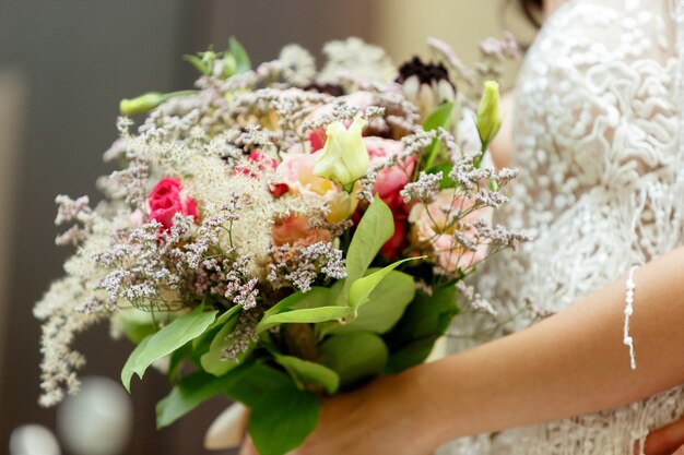 Caucasian romantic young bride celebrating marriage in city.