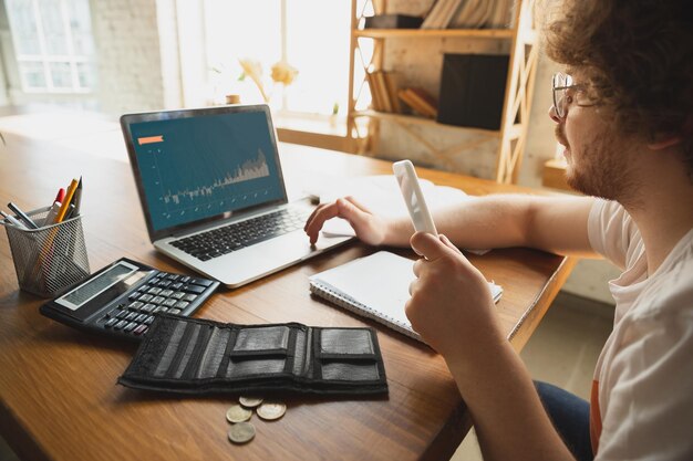 Caucasian upset and despair man doing financial and economical reports