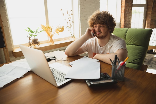 Caucasian upset and despair man watching financial and economical reports