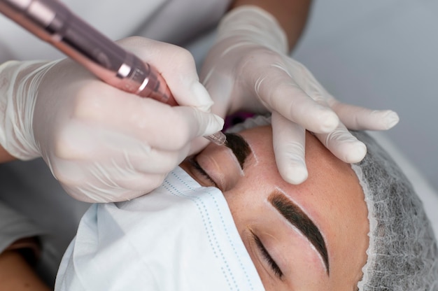 Caucasian woman going through a microblading treatment