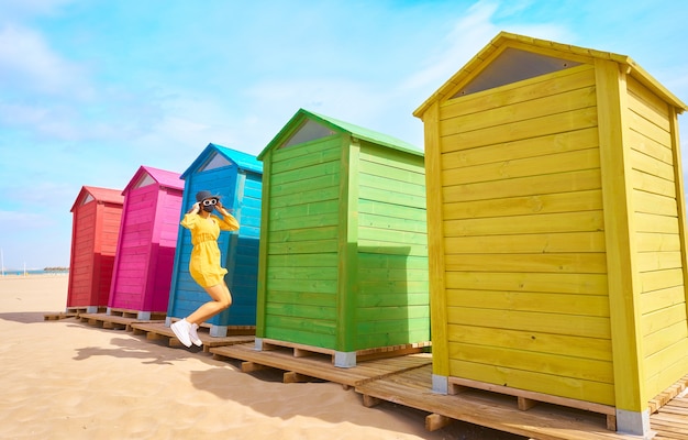 Caucasian woman in a mask on the beach