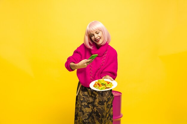 Caucasian woman's portrait on yellow