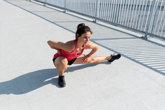 Caucasian woman stretching before exercising