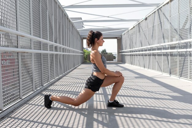 Caucasian woman stretching before exercising