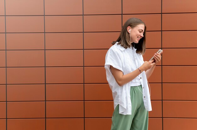 Caucasian woman texting someone on her smartphone