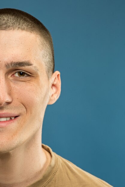 Caucasian young man's close up shot. Beautiful male model in shirt