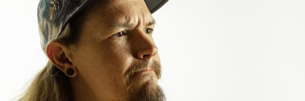 Caucasian young man's close up shot on studio, flyer