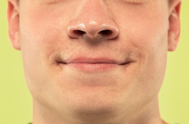 Caucasian young man's close up shot on studio