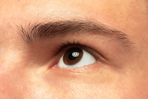 Caucasian young man's close up shot on studio