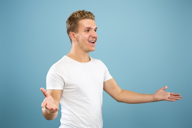 Caucasian young man's half-length portrait. Beautiful male model in shirt