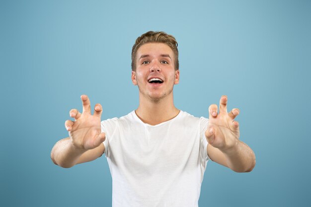 Caucasian young man's half-length portrait. Beautiful male model in shirt