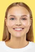 Free photo caucasian young woman's close up shot on yellow studio