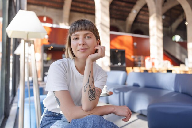 Caucasian young woman smiling at camera