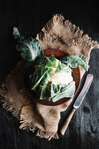 Cauliflower on a burlap fabric and knife