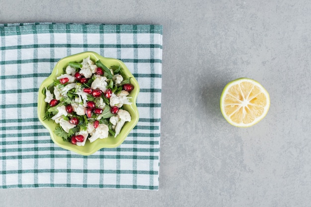 Cauliflower salad with herbs and pomegranate seeds.