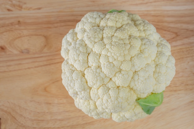 Cauliflower on the wooden floor.