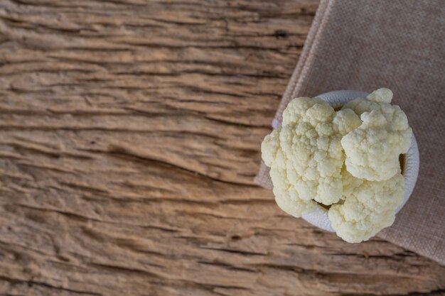 Cauliflower on the wooden floor.