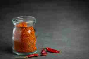 Free photo cayenne dried pepper in glass jar