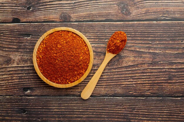 Cayenne dried pepper in small wooden plate