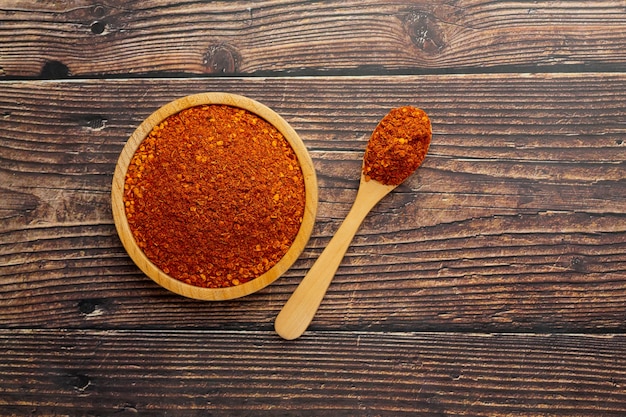 Cayenne dried pepper in small wooden plate