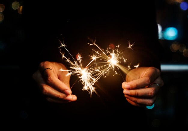 Celebrating with sparklers in the night