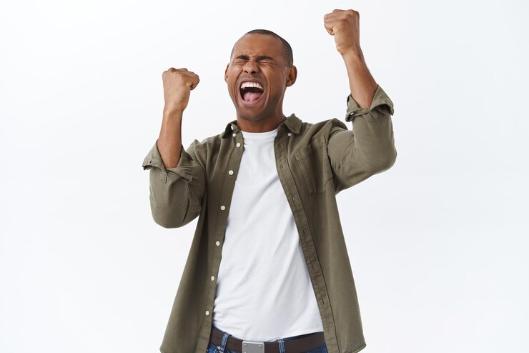 Free Photo celebration achievement and competition concept portrait of triumphing happy africanamerican man winning fist pump celebrating victory yelling yes standing white background