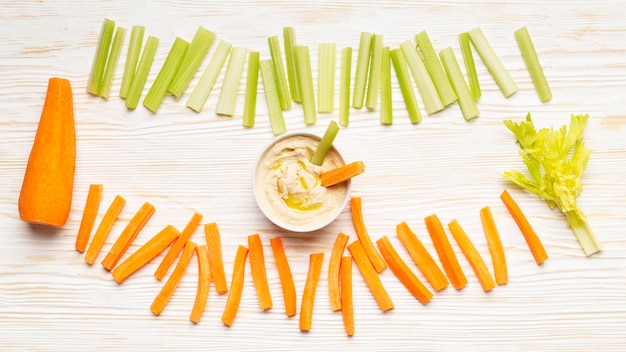 Free photo celery and carrot arrangement