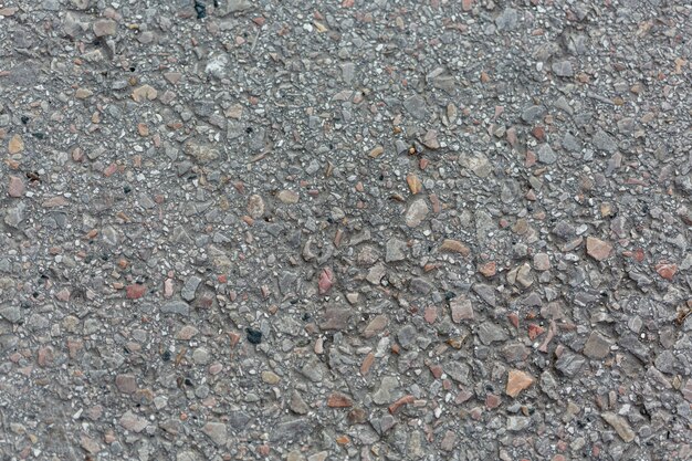 Cement surface with rocks and pebbles