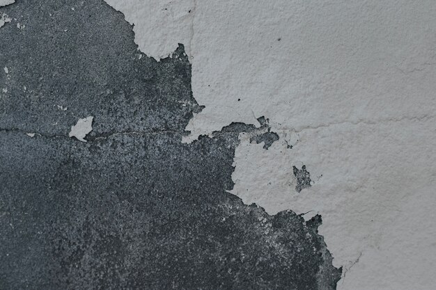 Cement wall with damaged paint