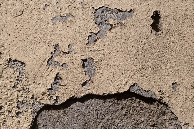 Cement wall with damaged paint