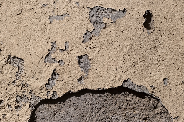 Cement wall with damaged paint